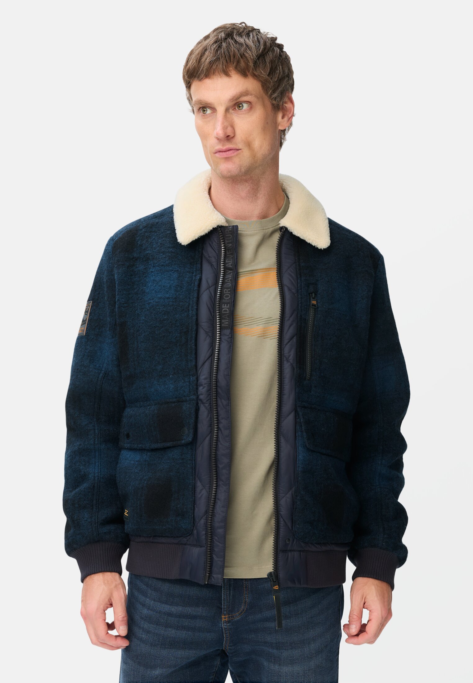 Men Bomber jacket with quilted pattern on the back tinted blue worn front