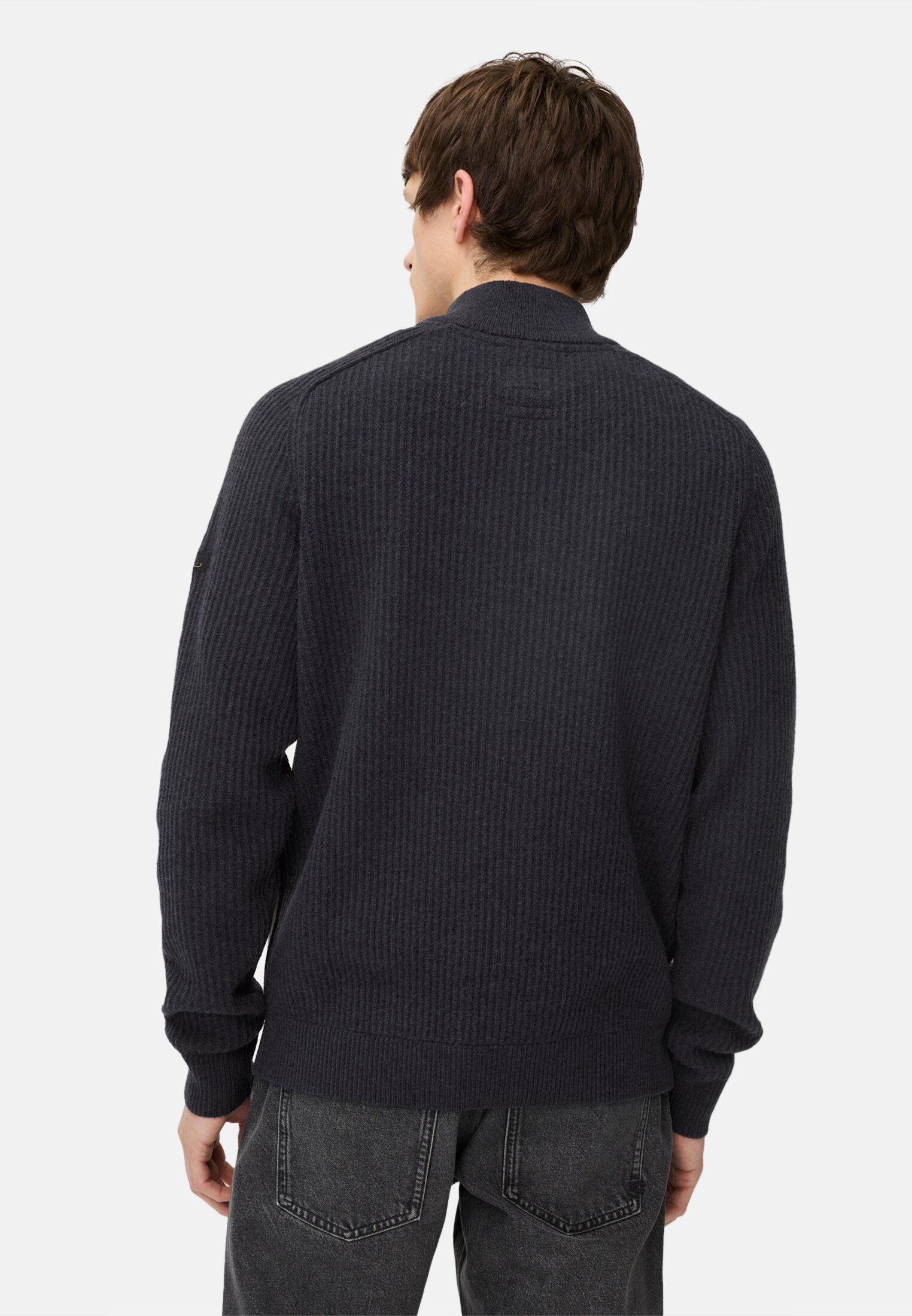 Men Knitted troyer made of pure wool Navy blue worn back