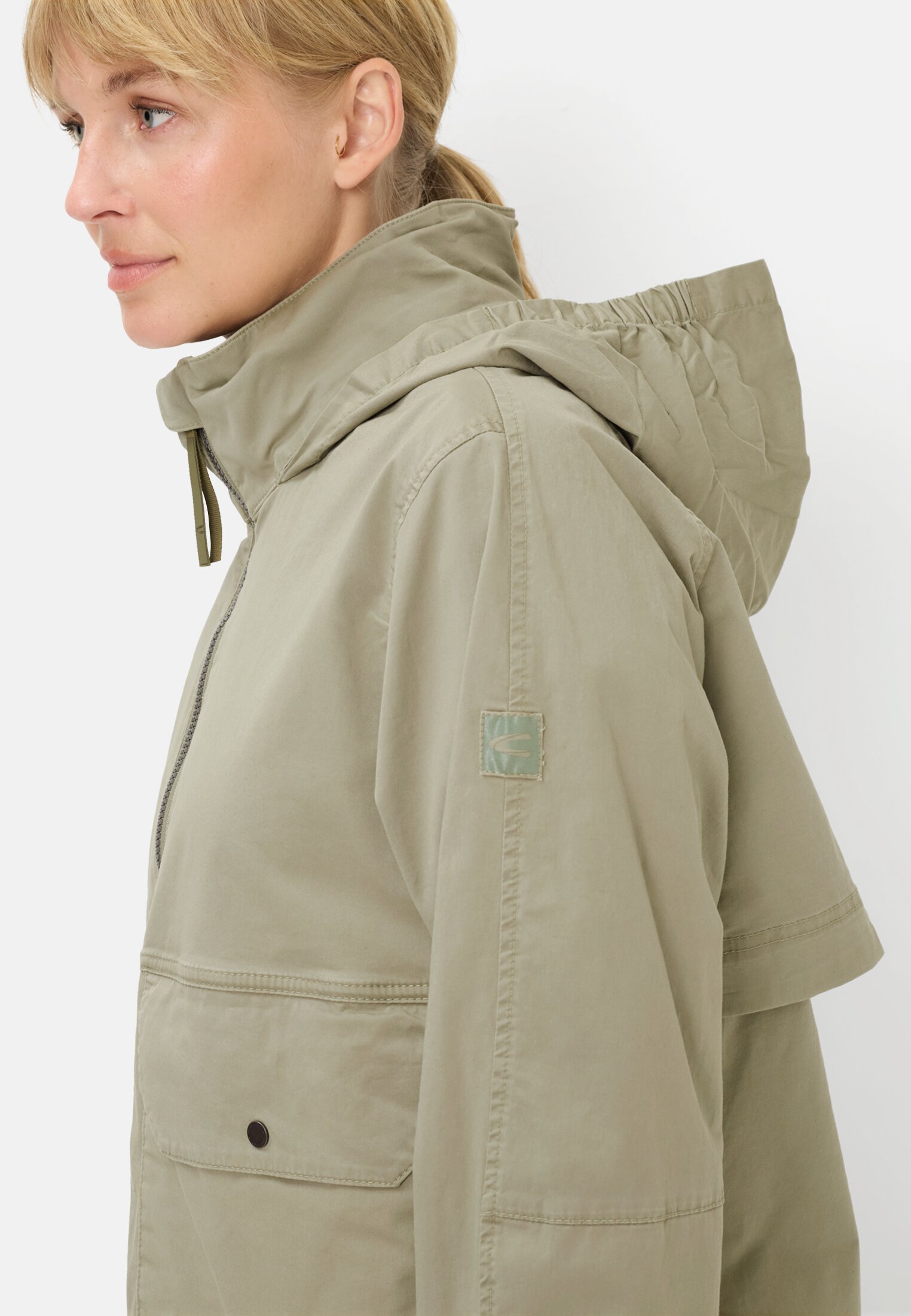 Women Blouson with a roll-out hood Sage worn detail close