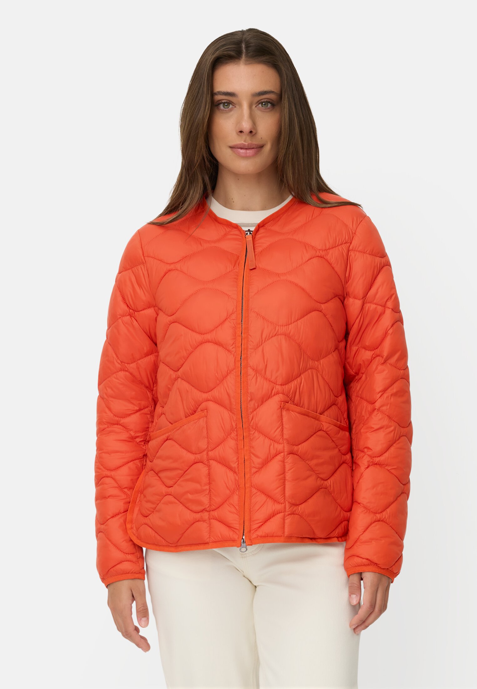 Damen Steppjacke mit 2-Wege Reißverschluss Orange getragen vorn