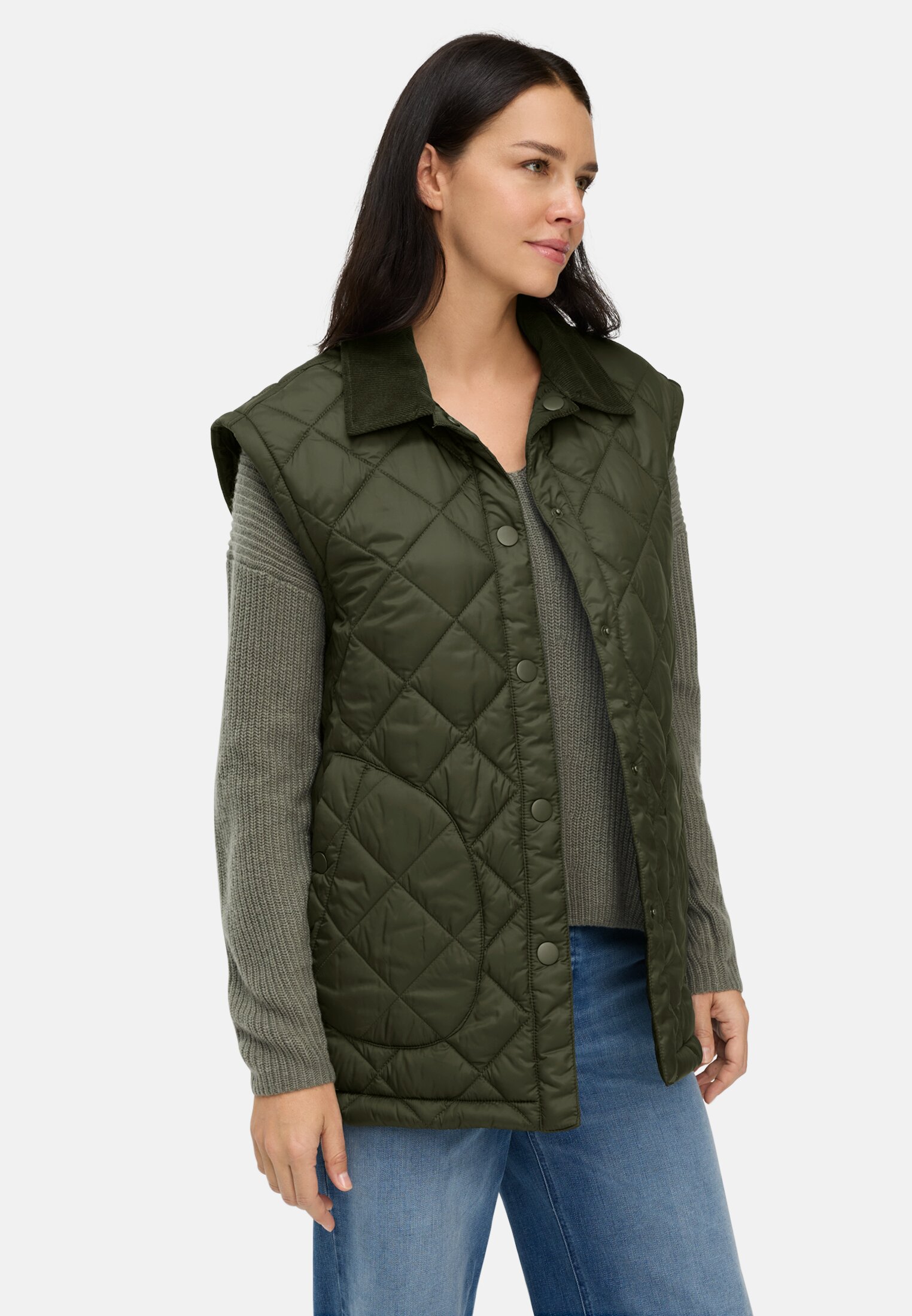 Women Quilted jacket with removable sleeves Forest Green worn emotional