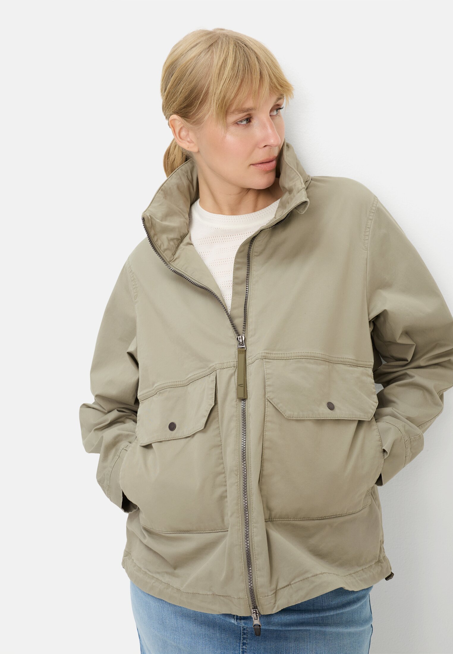 Women Blouson with a roll-out hood Sage worn emotional