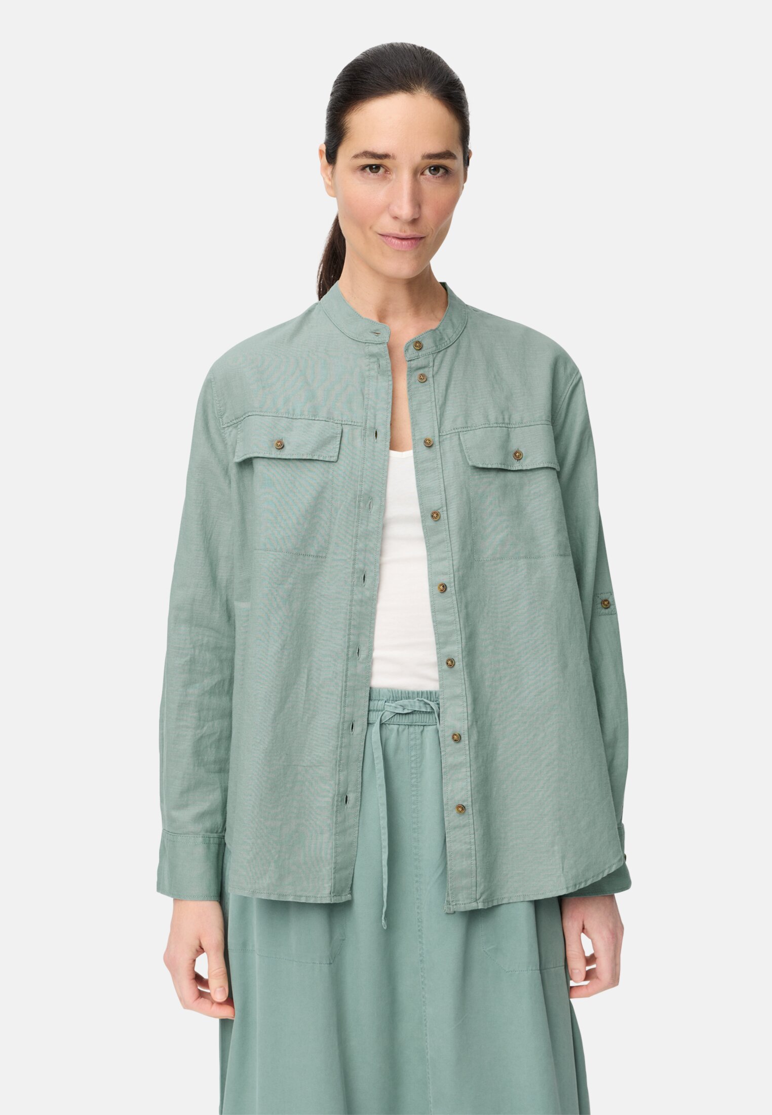 Women Blouse with stand-up collar and button placket Jade Blue worn front