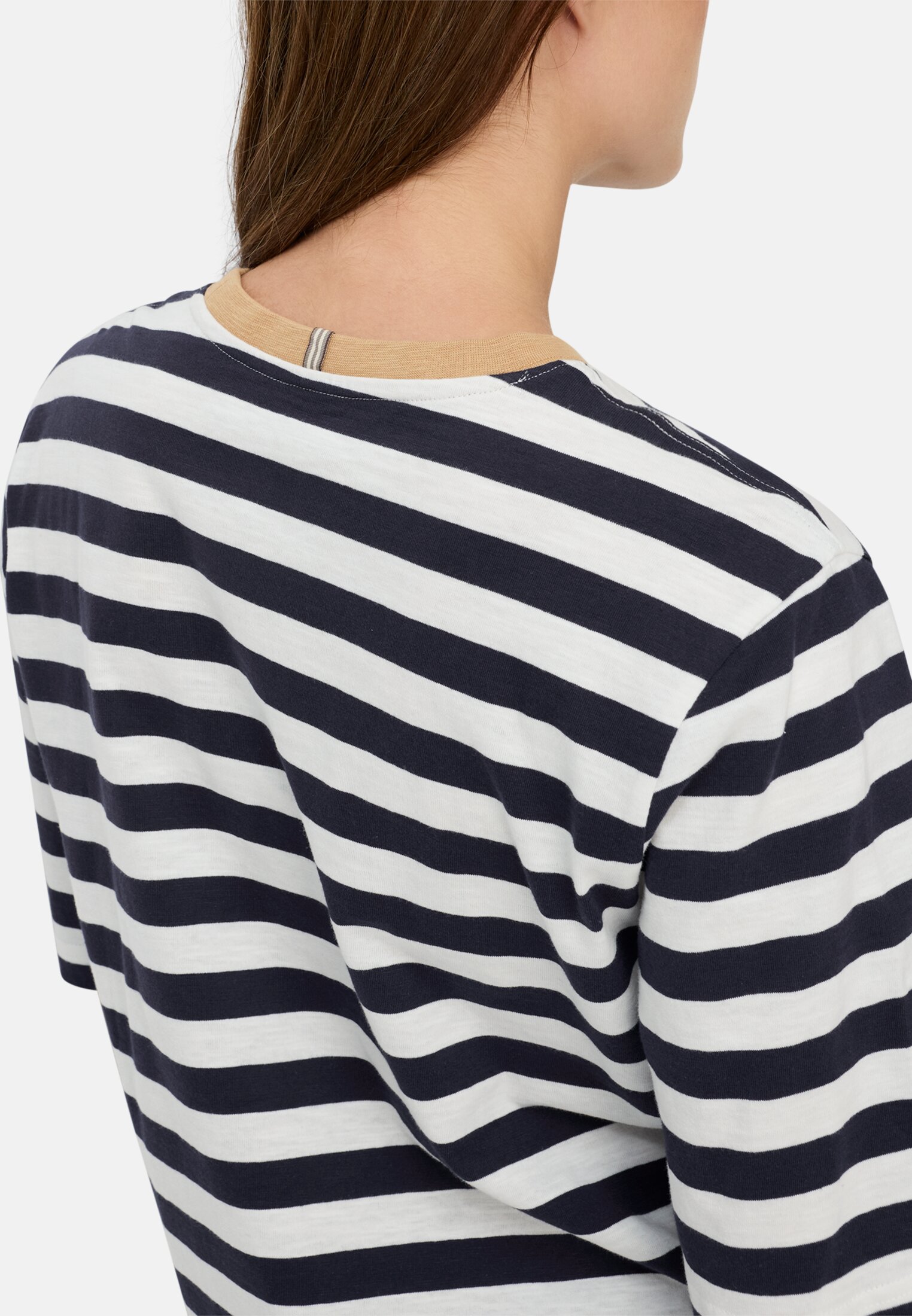 Women T-shirt with a striped pattern Blue and white striped worn detail close