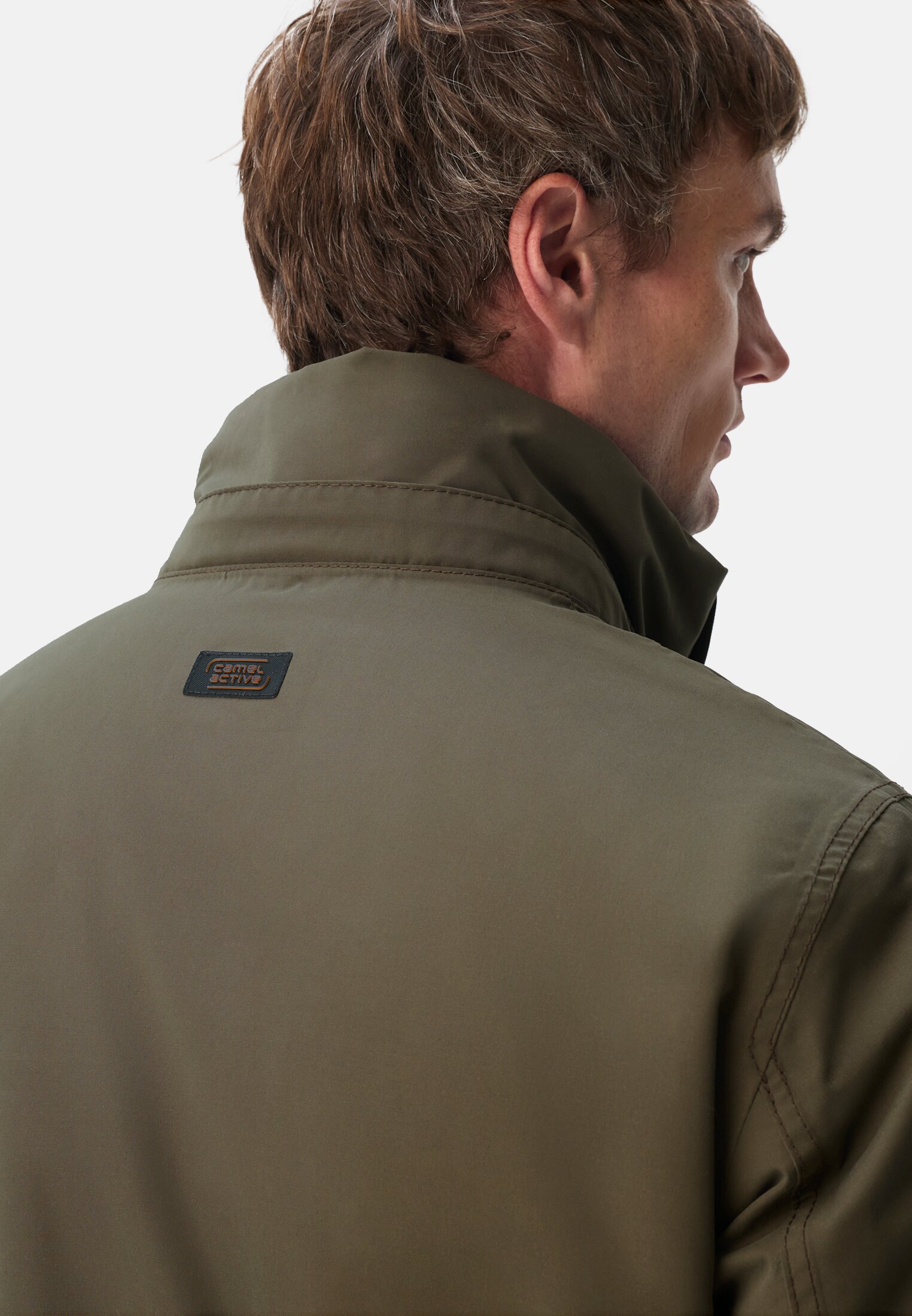 Men teXXXactive© functional jacket with removable hood Dark Green worn detail close