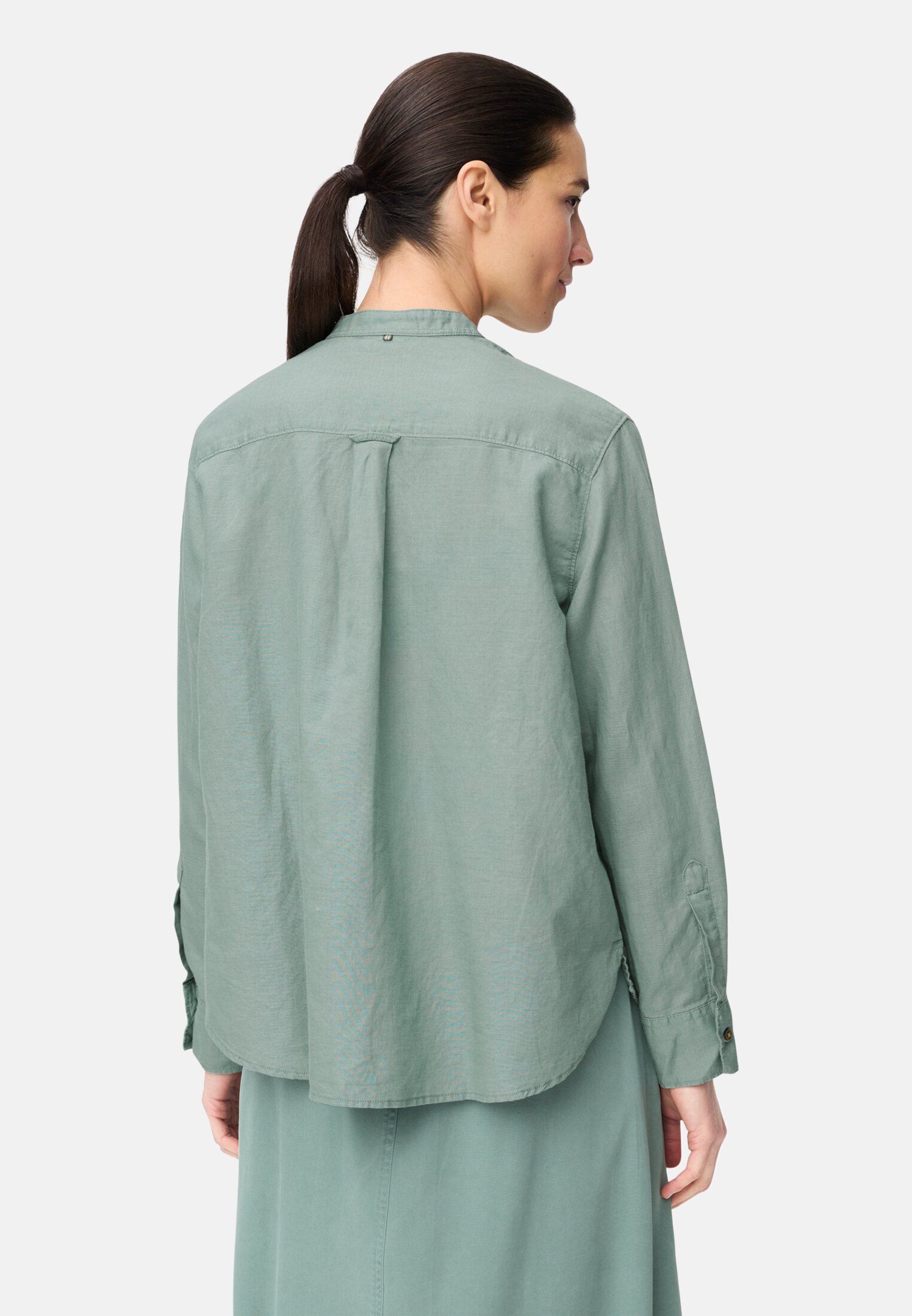 Women Blouse with stand-up collar and button placket Jade Blue worn back