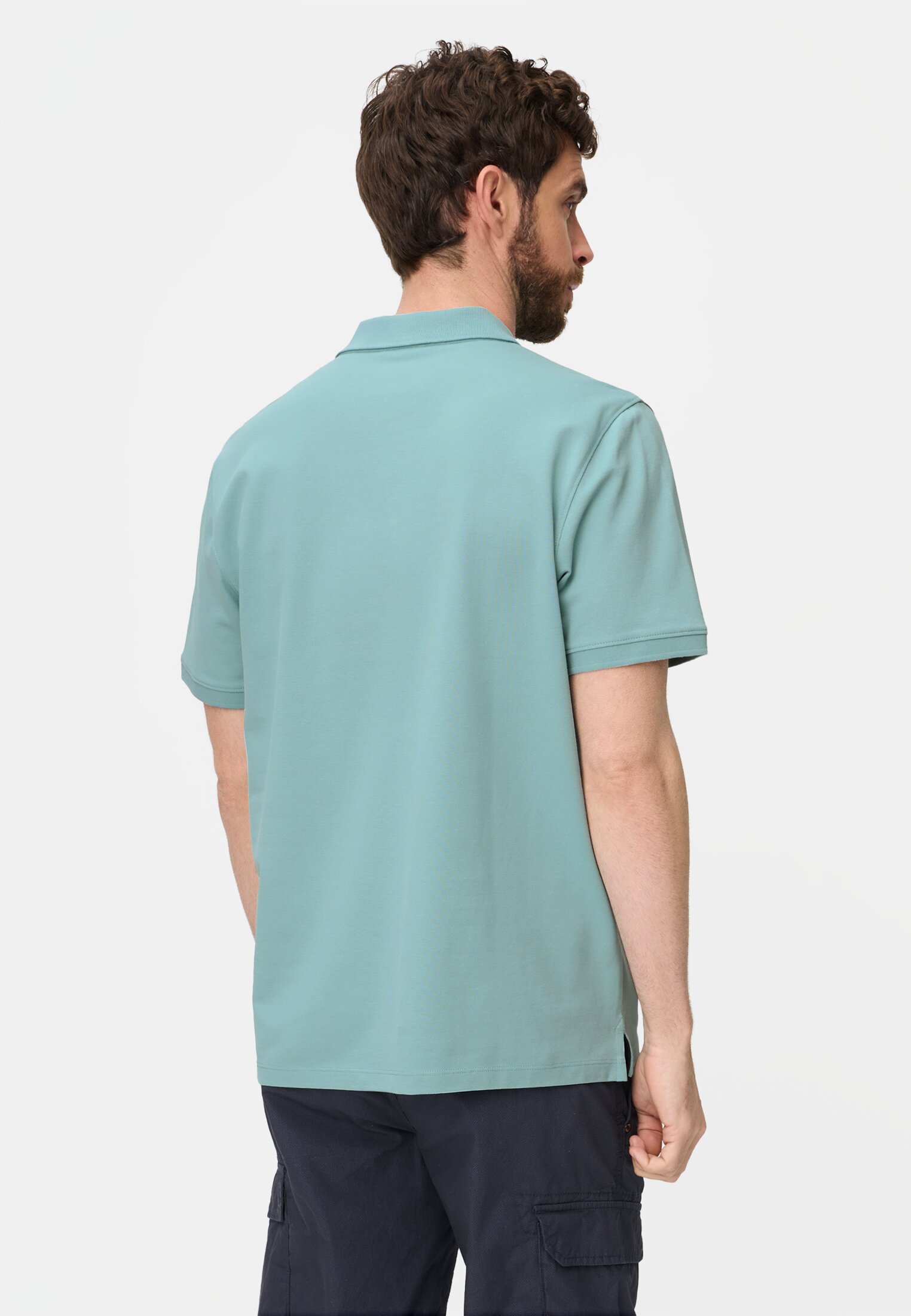 Heren Poloshirt met contrastdetails Oceaan Groen gedragen achter