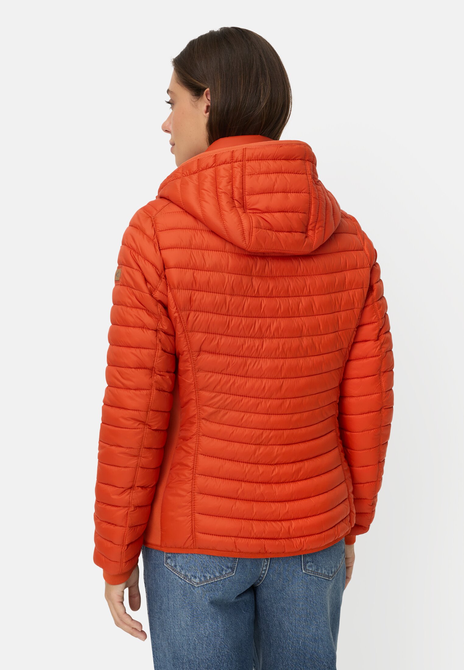Women Windproof jacket with side knit insert Orange worn back