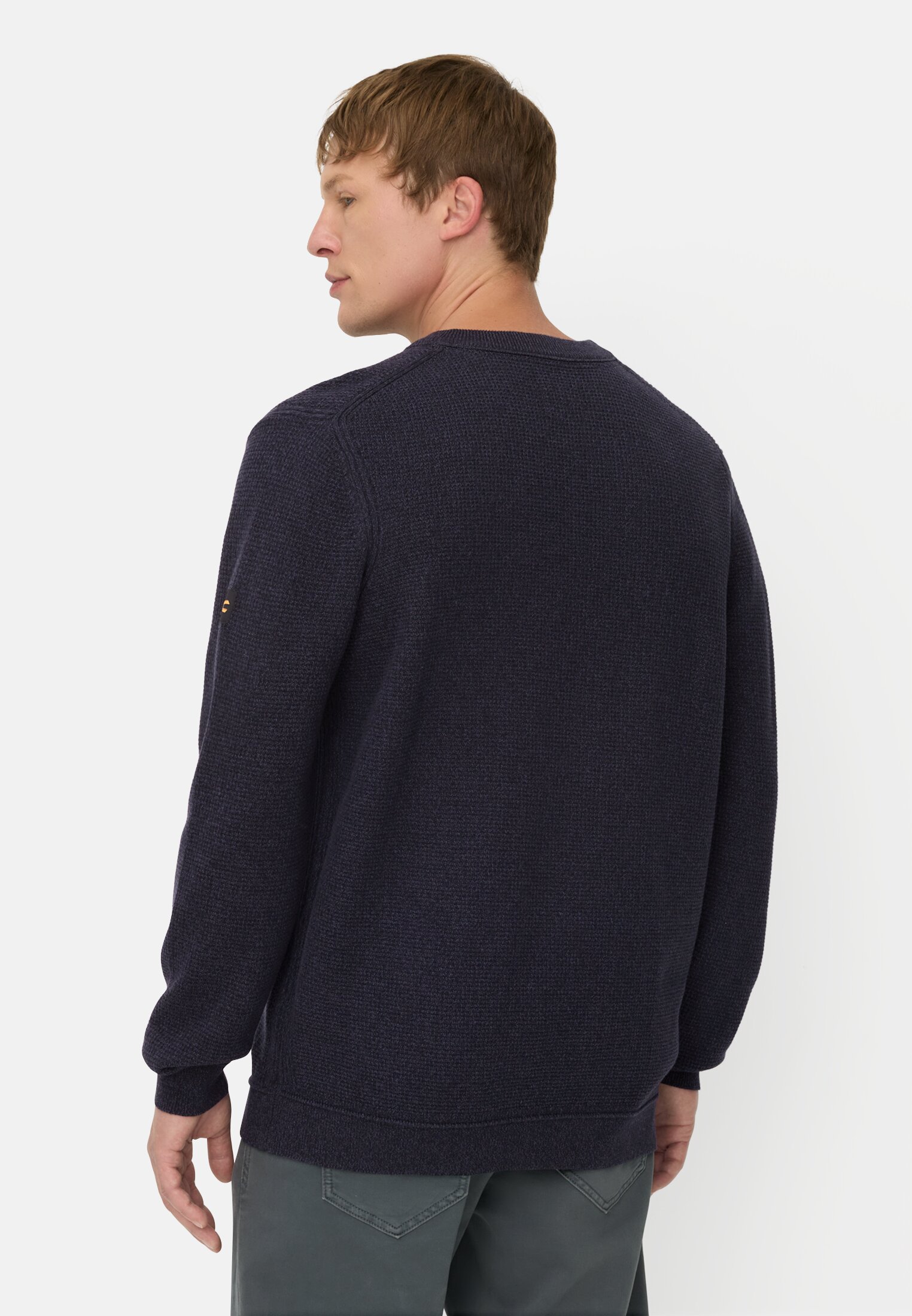 Men Knitted sweater with chest pocket Ink blue worn back