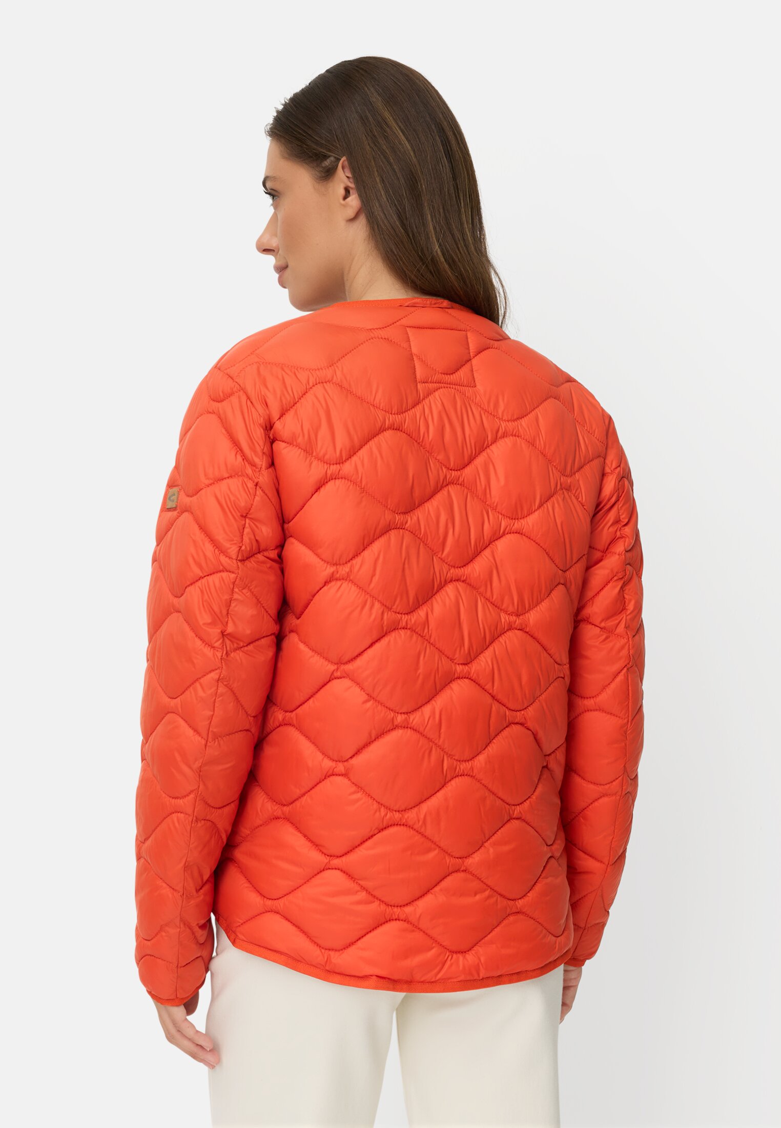 Women Quilted jacket with 2-way zipper Orange worn back
