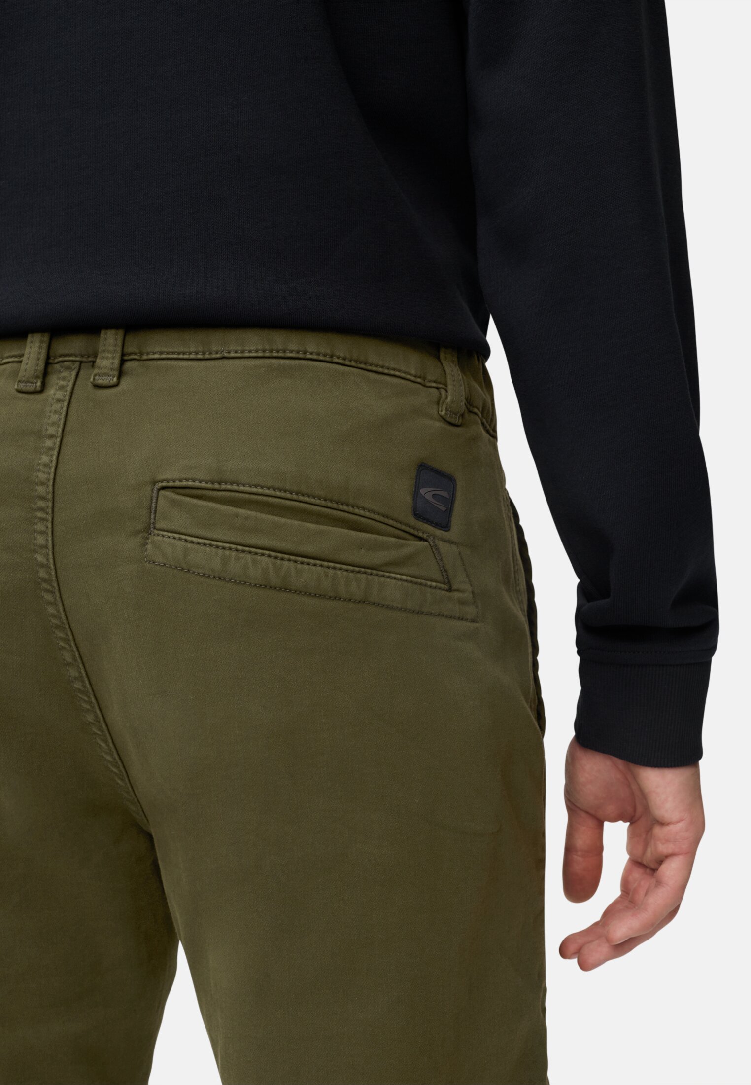 Men fleXXXactive® chinos regular fit made of cotton mix Forest green worn detail close