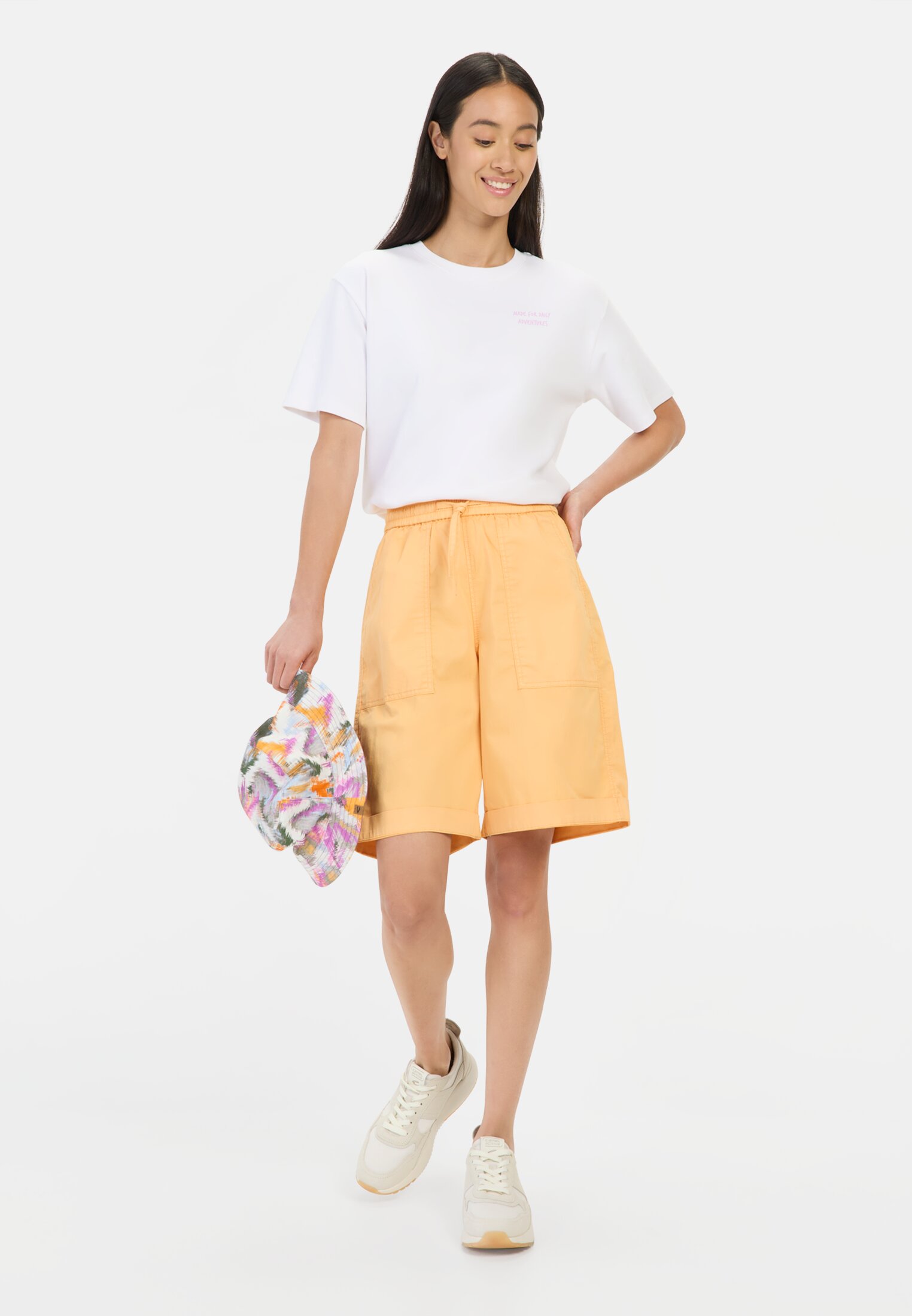 Women Bermuda shorts with elastic drawstring Orange worn front full body