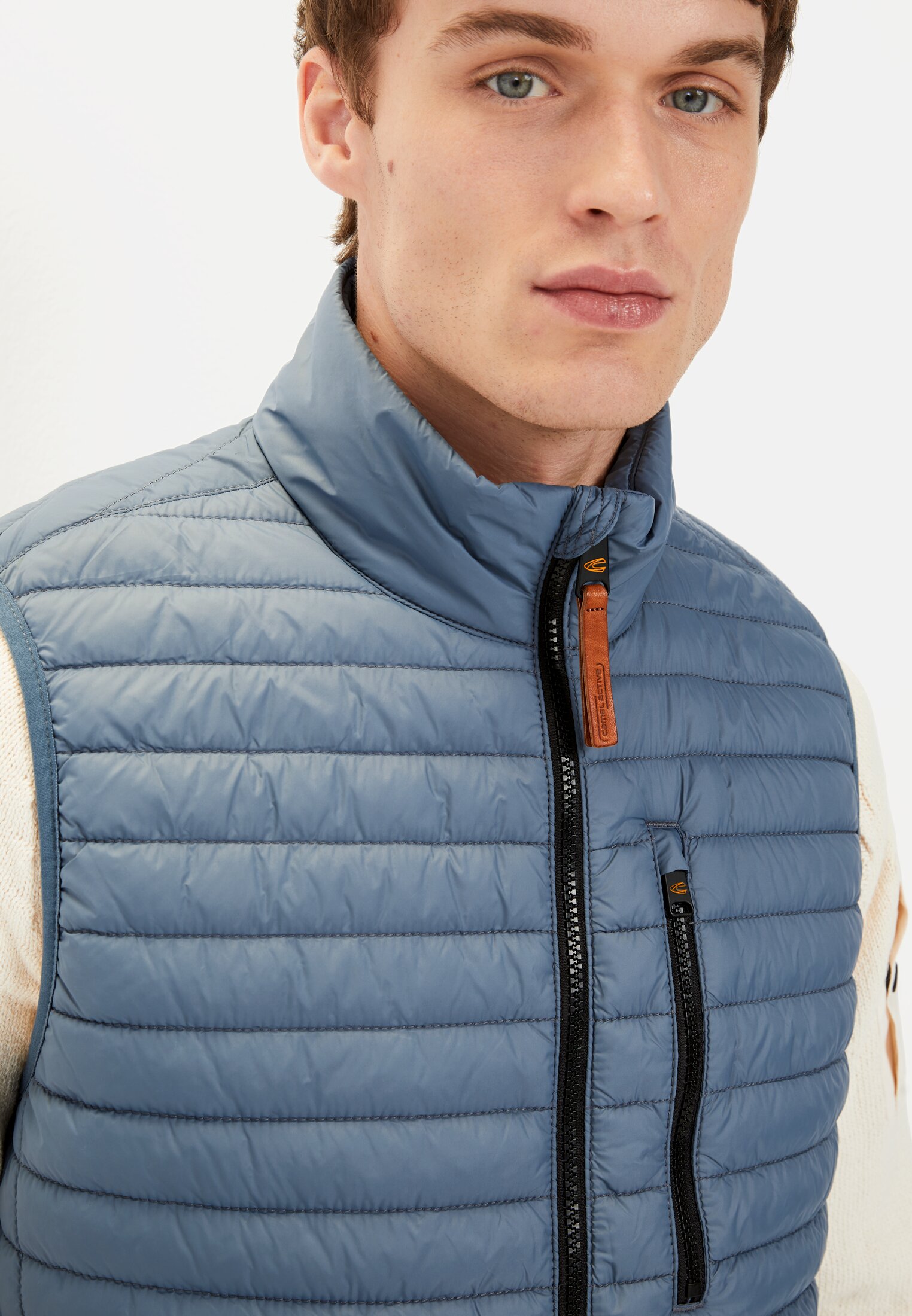 Men Quilted vest with stand-up collar Elemental Blue worn detail close