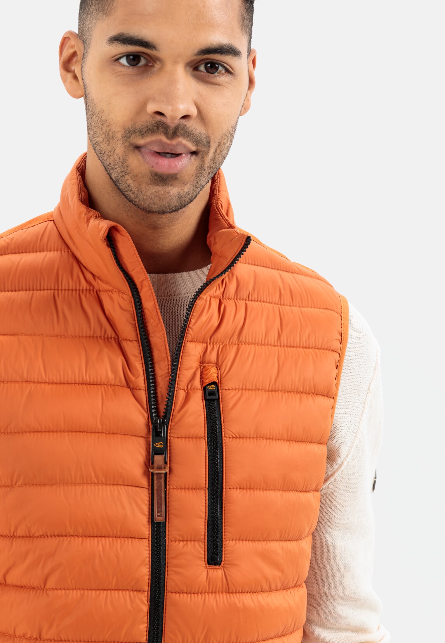 Men Quilted vest made from recycled polyester Orange worn detail close