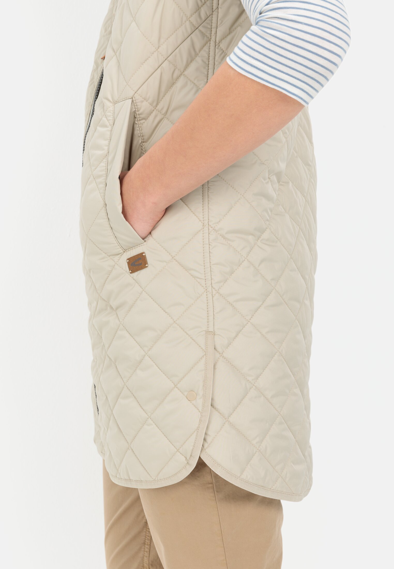 Women Long quilted vest made from recycled polyester Light Sage worn detail close