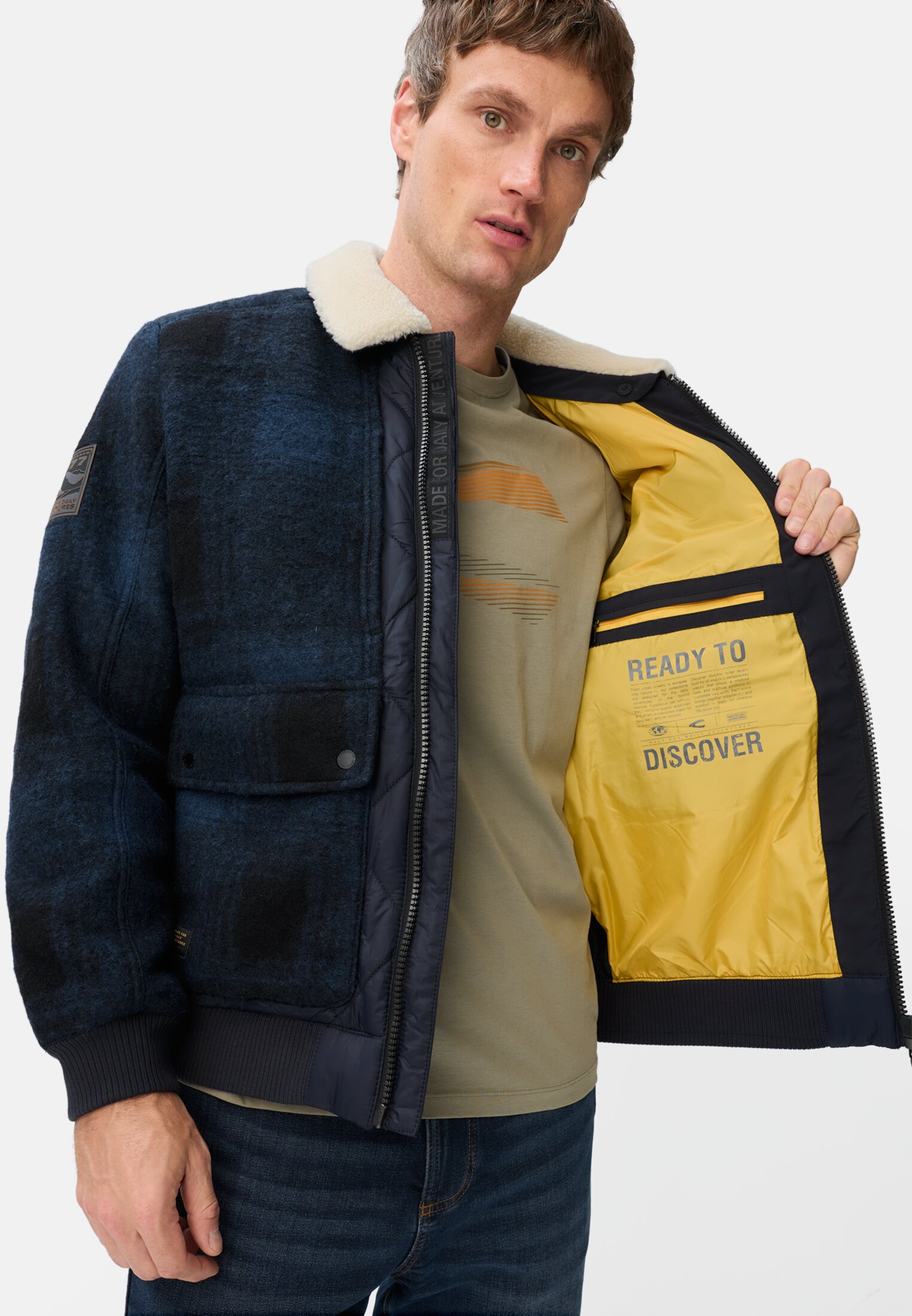 Men Bomber jacket with quilted pattern on the back tinted blue worn emotional