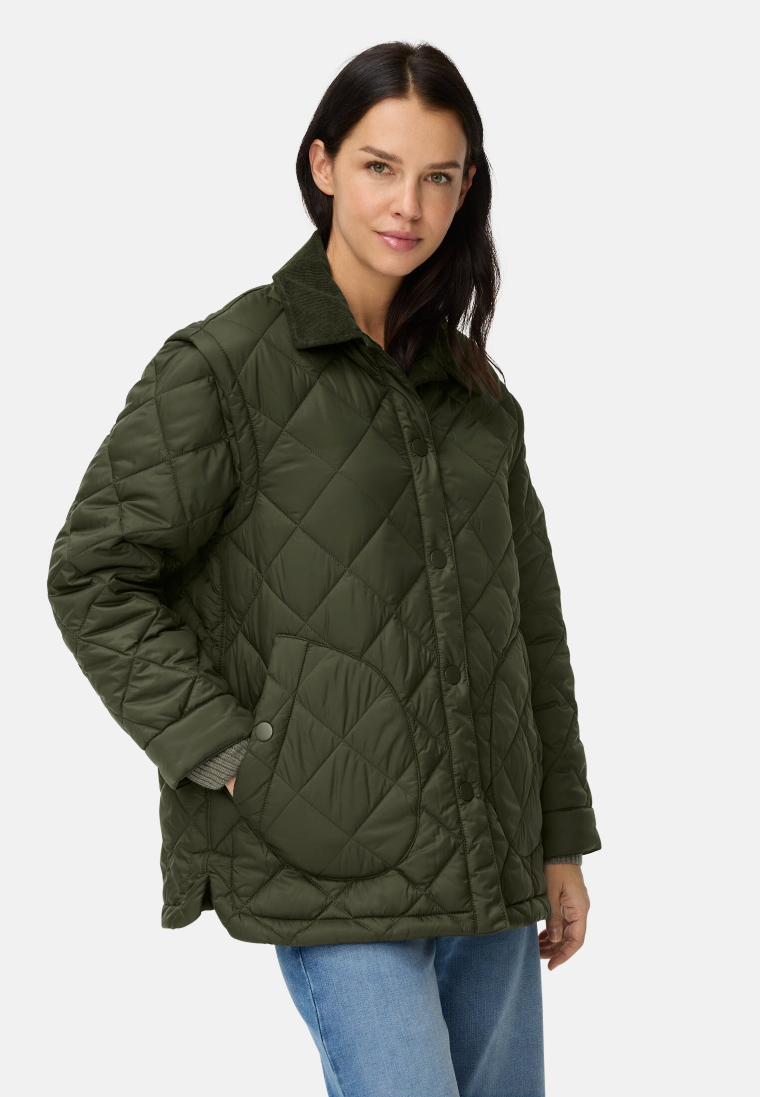 Women Quilted jacket with removable sleeves Forest Green worn front