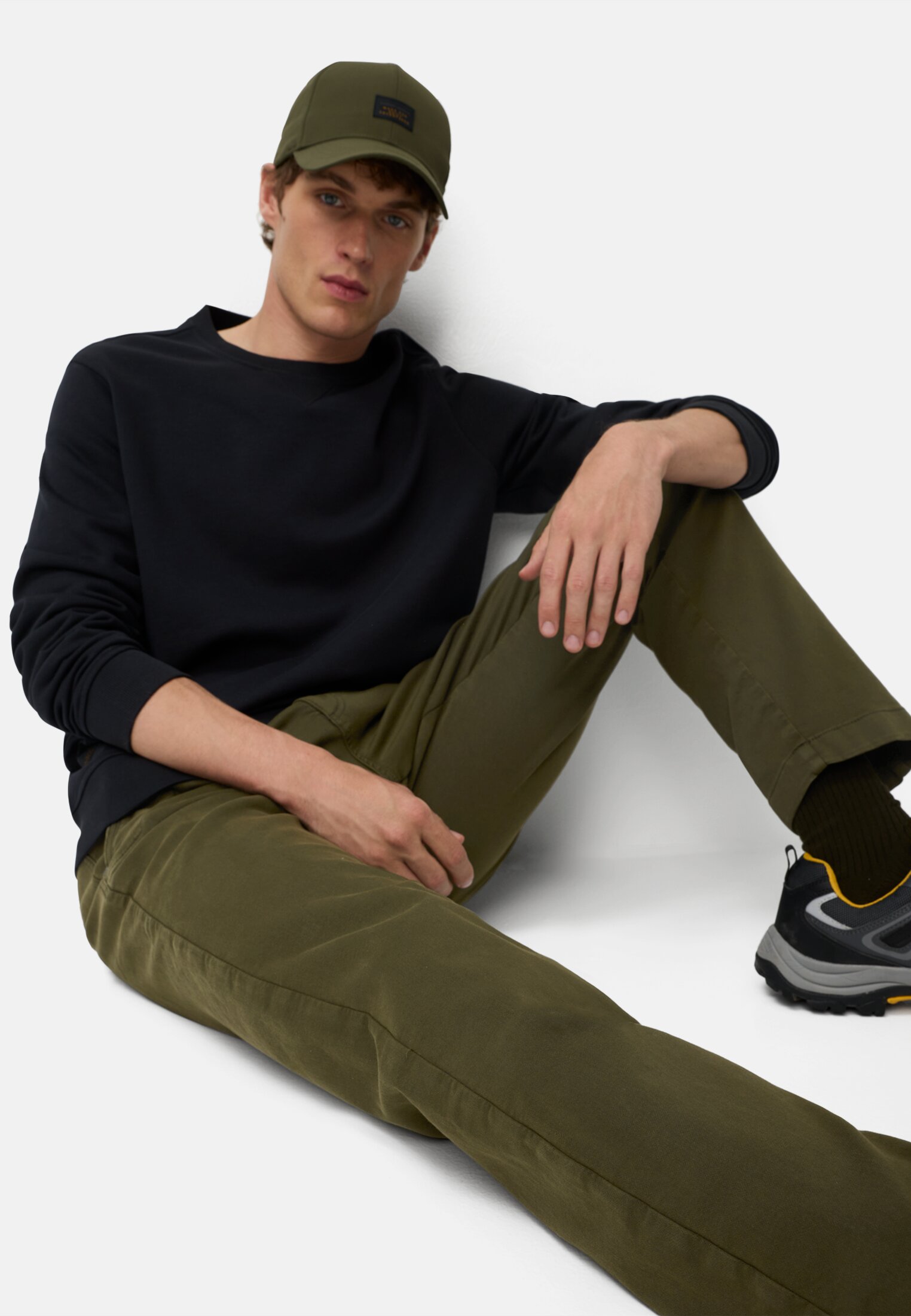 Men fleXXXactive® chinos regular fit made of cotton mix Forest green worn emotional